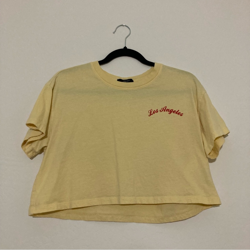Forever 21 pastel yellow ‘Los Angeles’ text short sleeve crop top